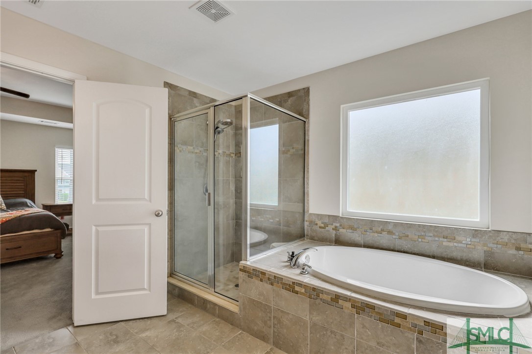 80 Smoke Rise Road Richmond Hill, GA 31324 - Photo 33 of 42 Tile surround tub and separate shower in master