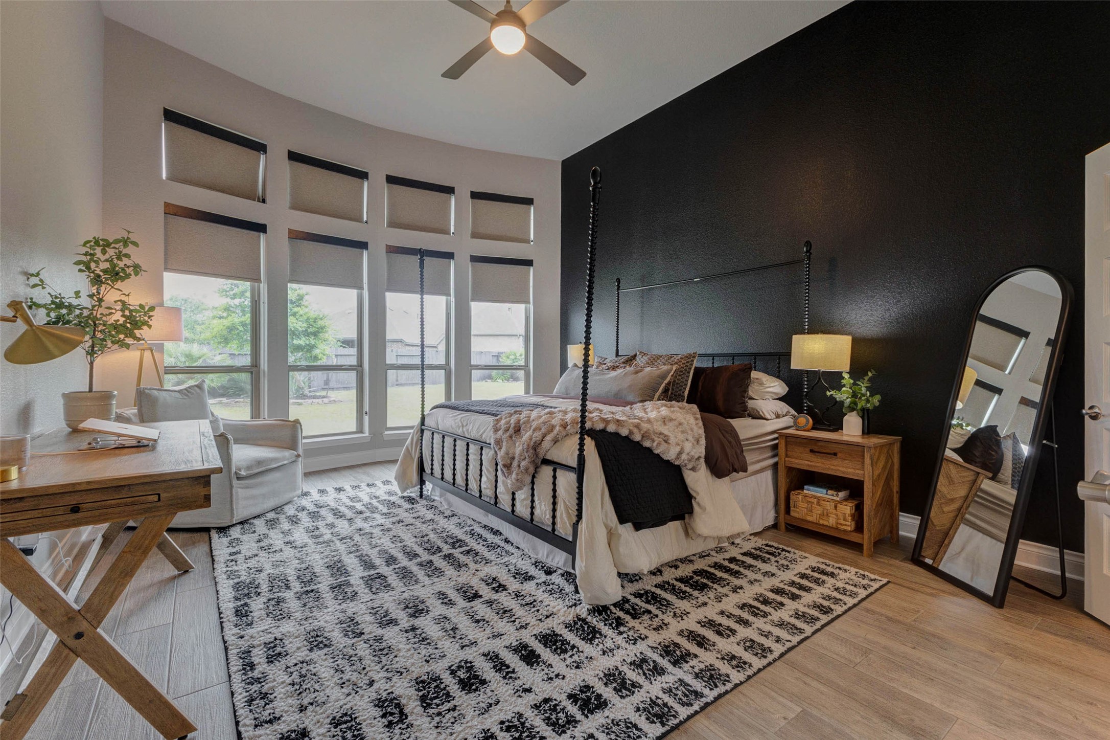4303 Tupelo Leaf Court Manvel, TX 77578 - Photo 28 of 50 a spacious bedroom with a bed a table and a large window