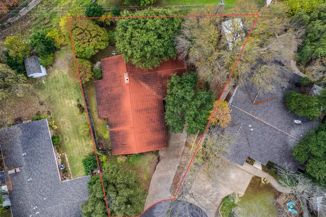 an aerial view of a house with outdoor space