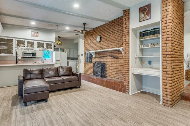 a living room with furniture and a fireplace