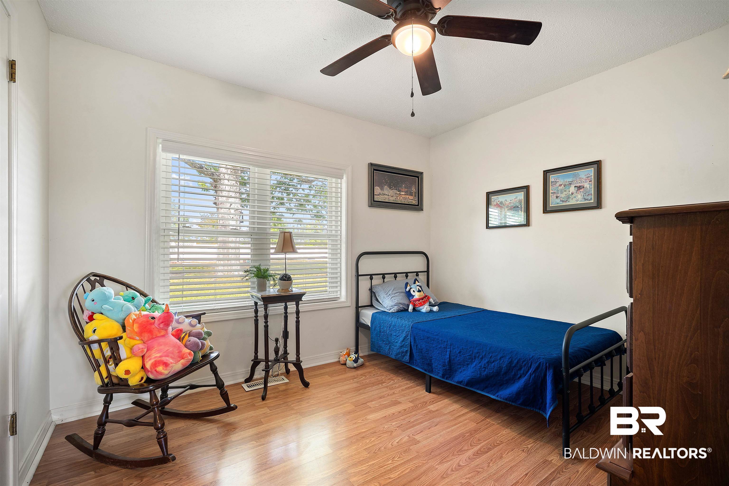 22 Horace Odom Road Millry, AL 36558 - Photo 26 of 39 Bedroom featuring light wood-style floors and a ceiling fan