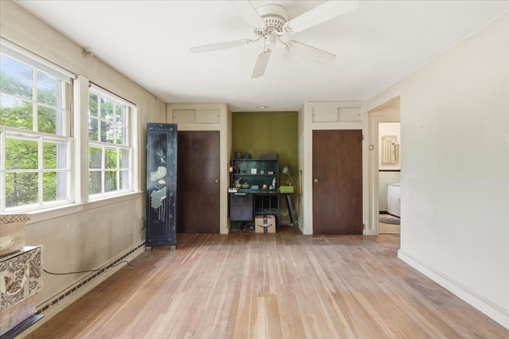 99 Brook Road Sharon, MA 02067 - Photo 26 of 37 wooden floor in an empty room with a window