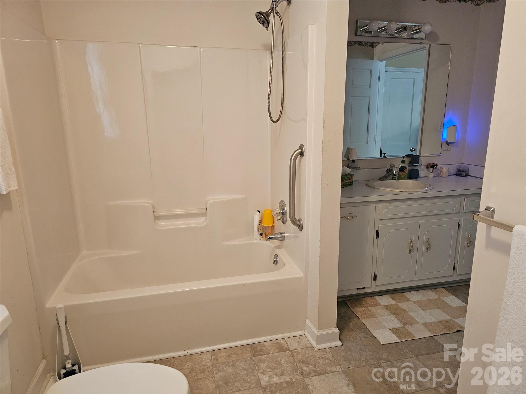 711 Chesterfield Avenue Lancaster, SC 29720 - Photo 12 of 19 a bathroom with a bath tub and a sink