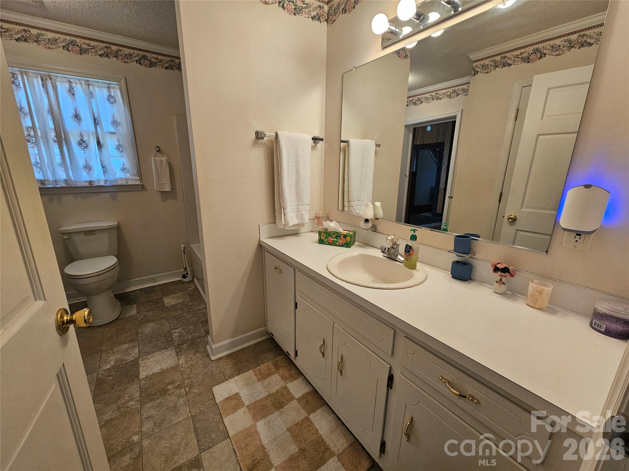 711 Chesterfield Avenue Lancaster, SC 29720 - Photo 13 of 19 a bathroom with a double vanity sink mirror vanity and toilet