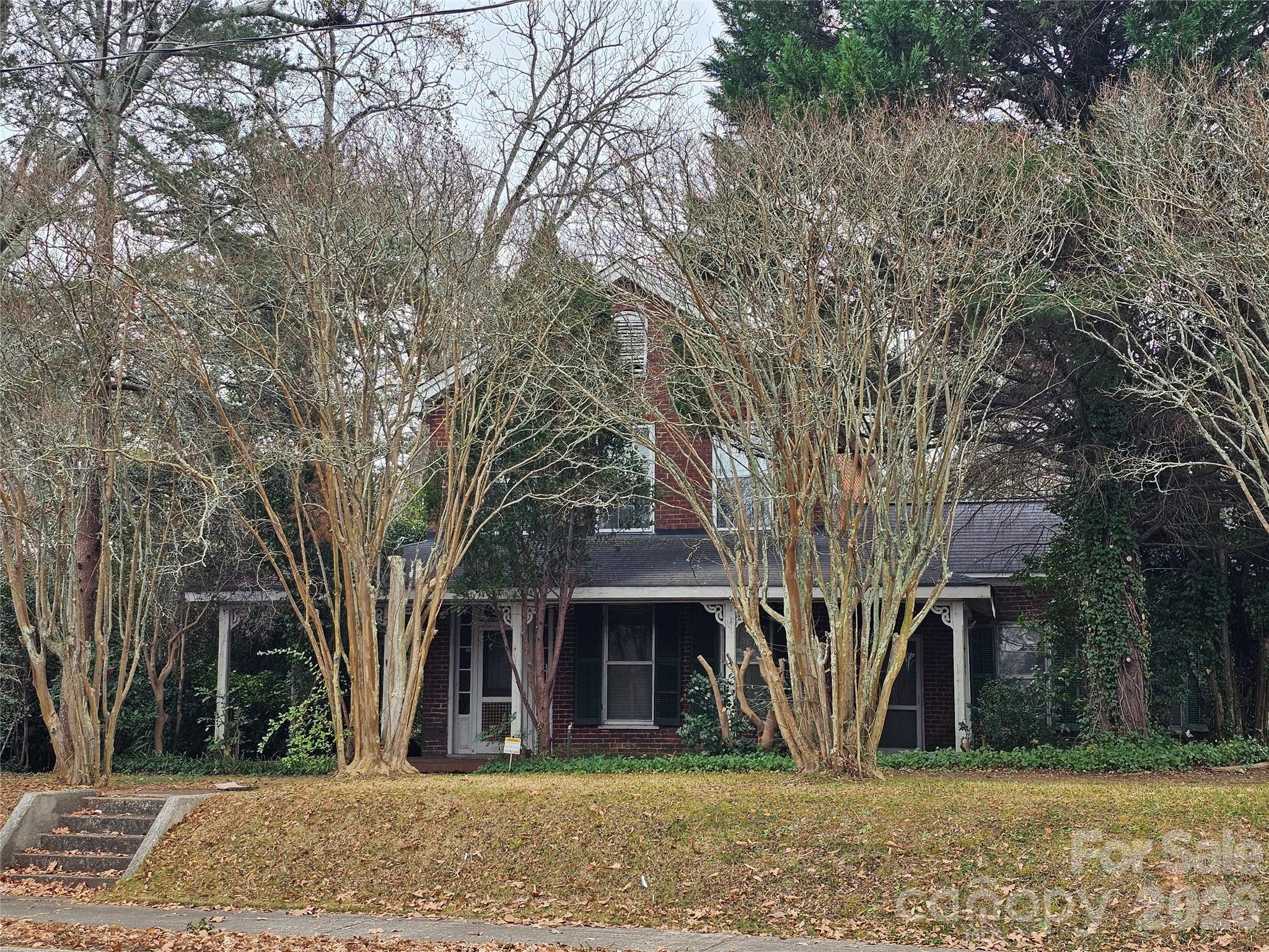 711 Chesterfield Avenue Lancaster, SC 29720 - Photo 2 of 19 front view of a house with a trees