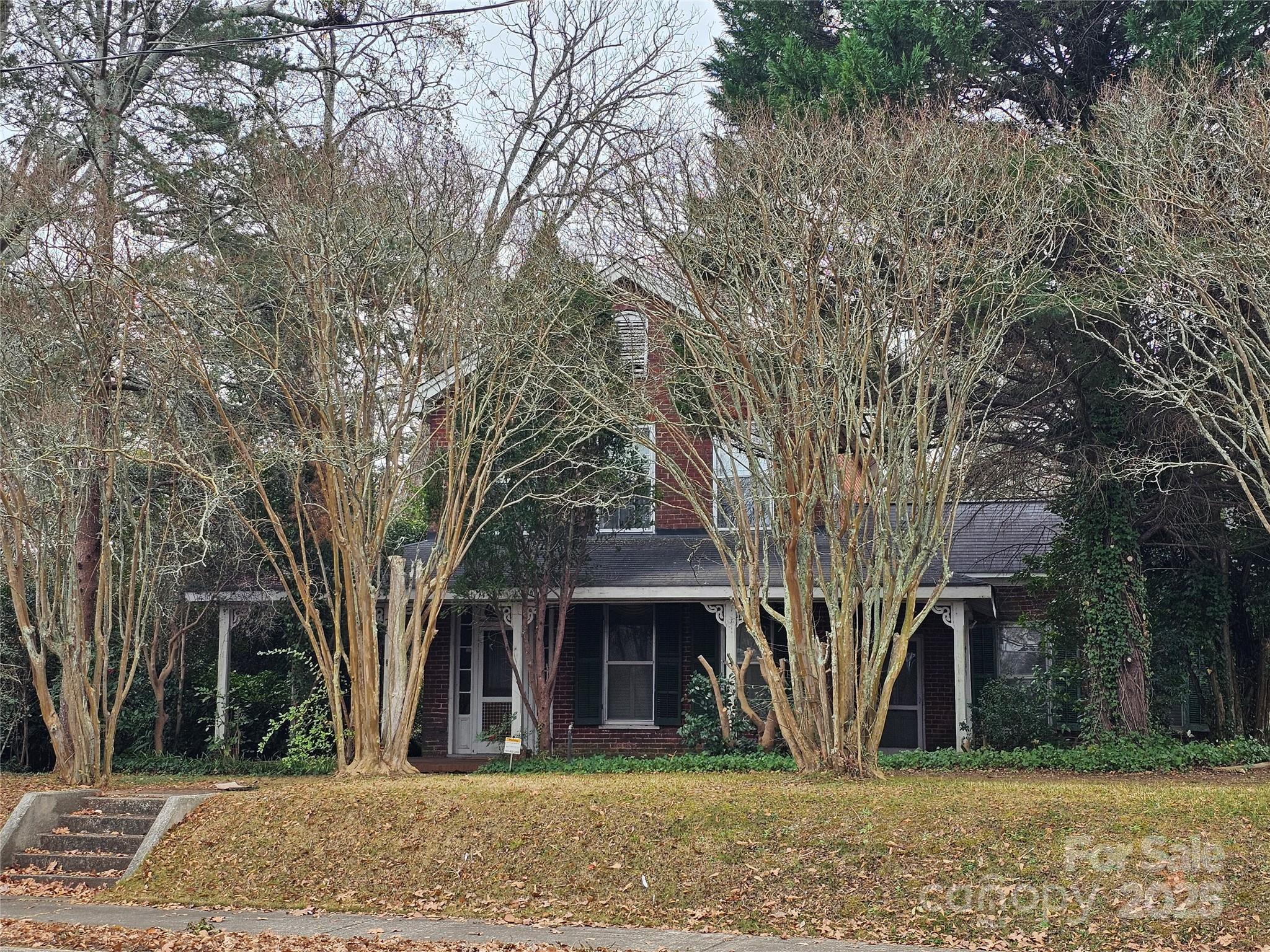 711 Chesterfield Avenue Lancaster, SC 29720 - Photo 2 of 2 front view of a house with a trees