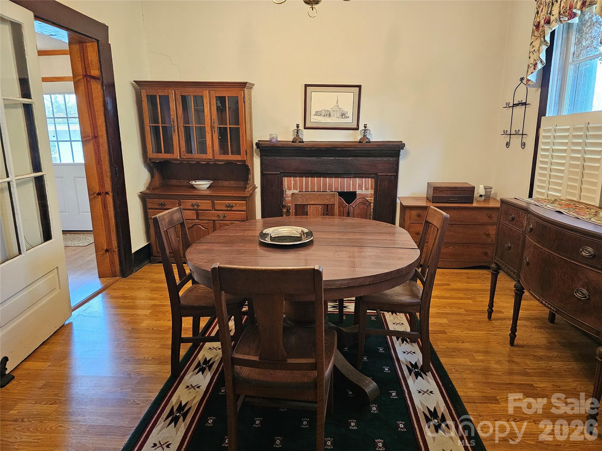 711 Chesterfield Avenue Lancaster, SC 29720 - Photo 3 of 19 a view of a dining room with furniture window and wooden floor