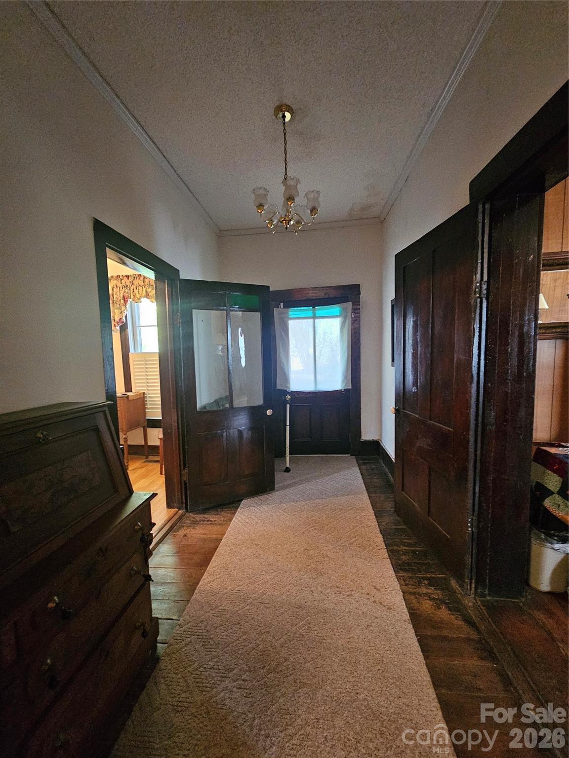 711 Chesterfield Avenue Lancaster, SC 29720 - Photo 6 of 19 a bedroom with a bed large mirror on dresser and a window