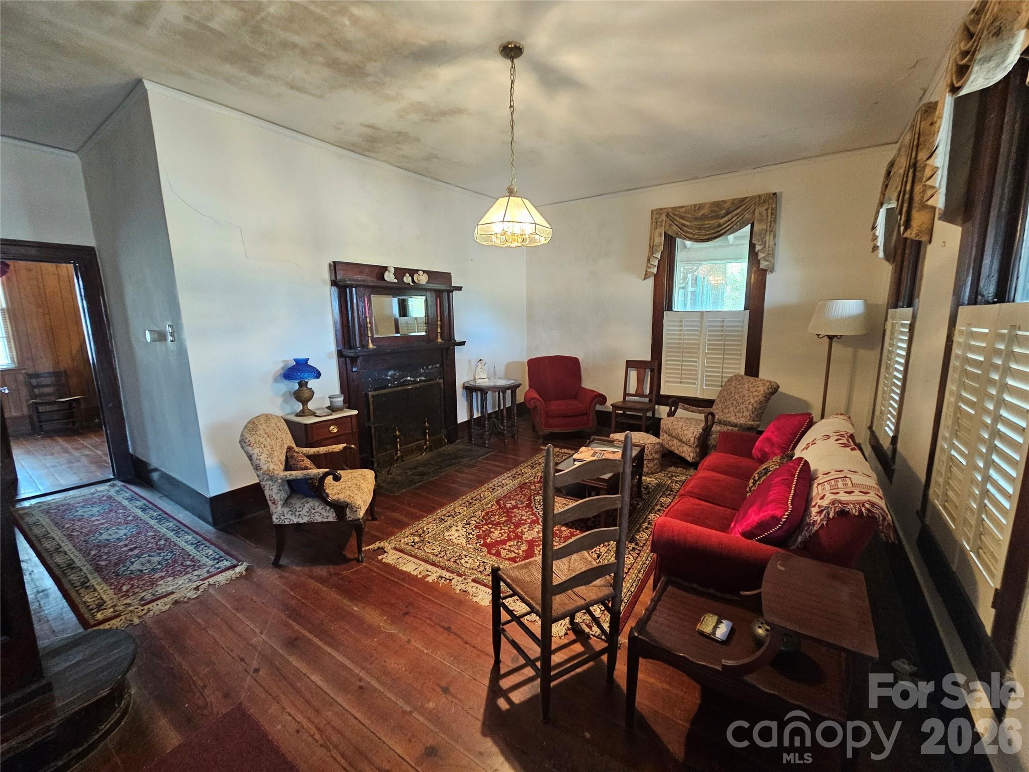 711 Chesterfield Avenue Lancaster, SC 29720 - Photo 8 of 19 a living room with furniture a couch and a chandelier