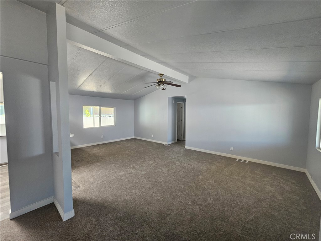1721 East Colton Avenue, Unit 33 Redlands, CA 92374 - Photo 7 of 17 an empty room with windows