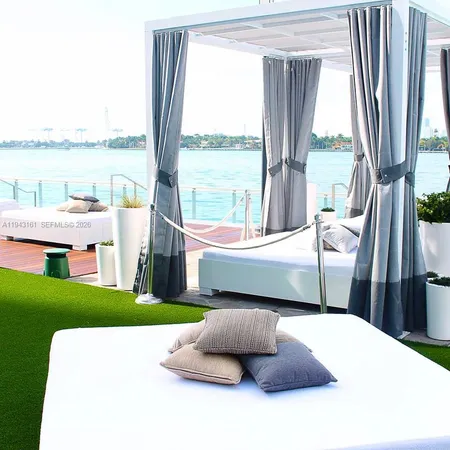 a living room with a couch and a large window