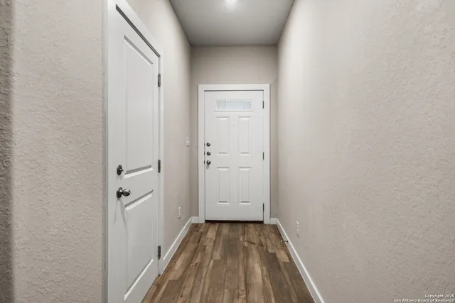a view of a bathroom with wooden floor