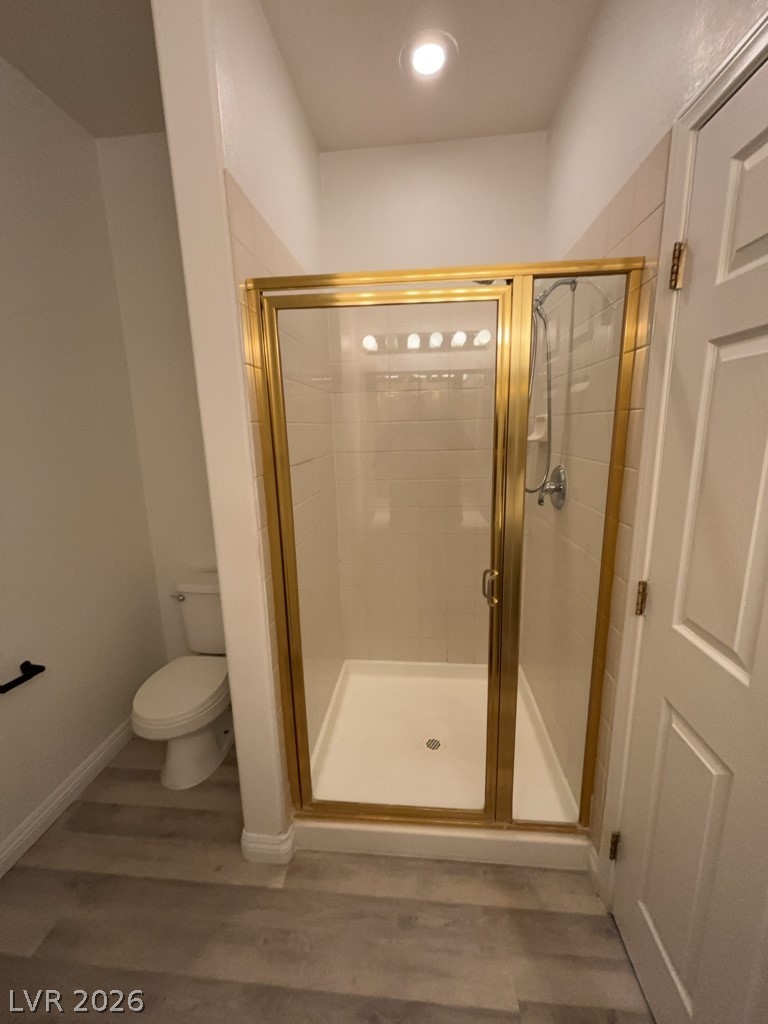 4915 East Russell Road, Unit 159 Las Vegas, NV 89120 - Photo 11 of 12 Bathroom with a stall shower and wood finished floors