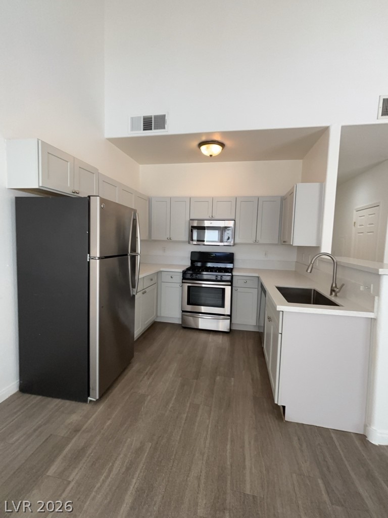 4915 East Russell Road, Unit 159 Las Vegas, NV 89120 - Photo 12 of 12 Kitchen featuring stainless steel appliances, gray cabinets, and dark wood-type flooring
