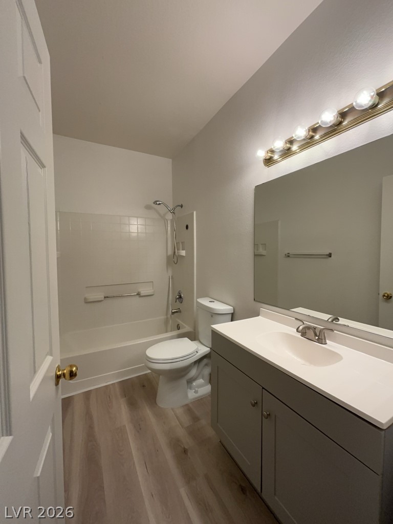 4915 East Russell Road, Unit 159 Las Vegas, NV 89120 - Photo 9 of 12 Full bath with vanity, shower / tub combination, and light wood-style flooring