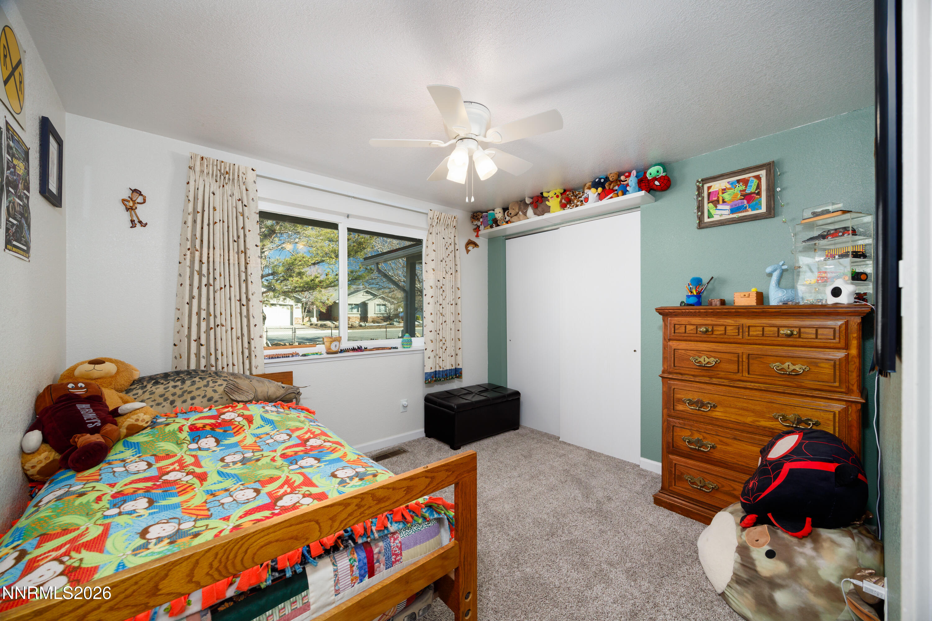 450 Riparian Way Carson City, NV 89701 - Photo 13 of 27 a bedroom with a bed and a window in it
