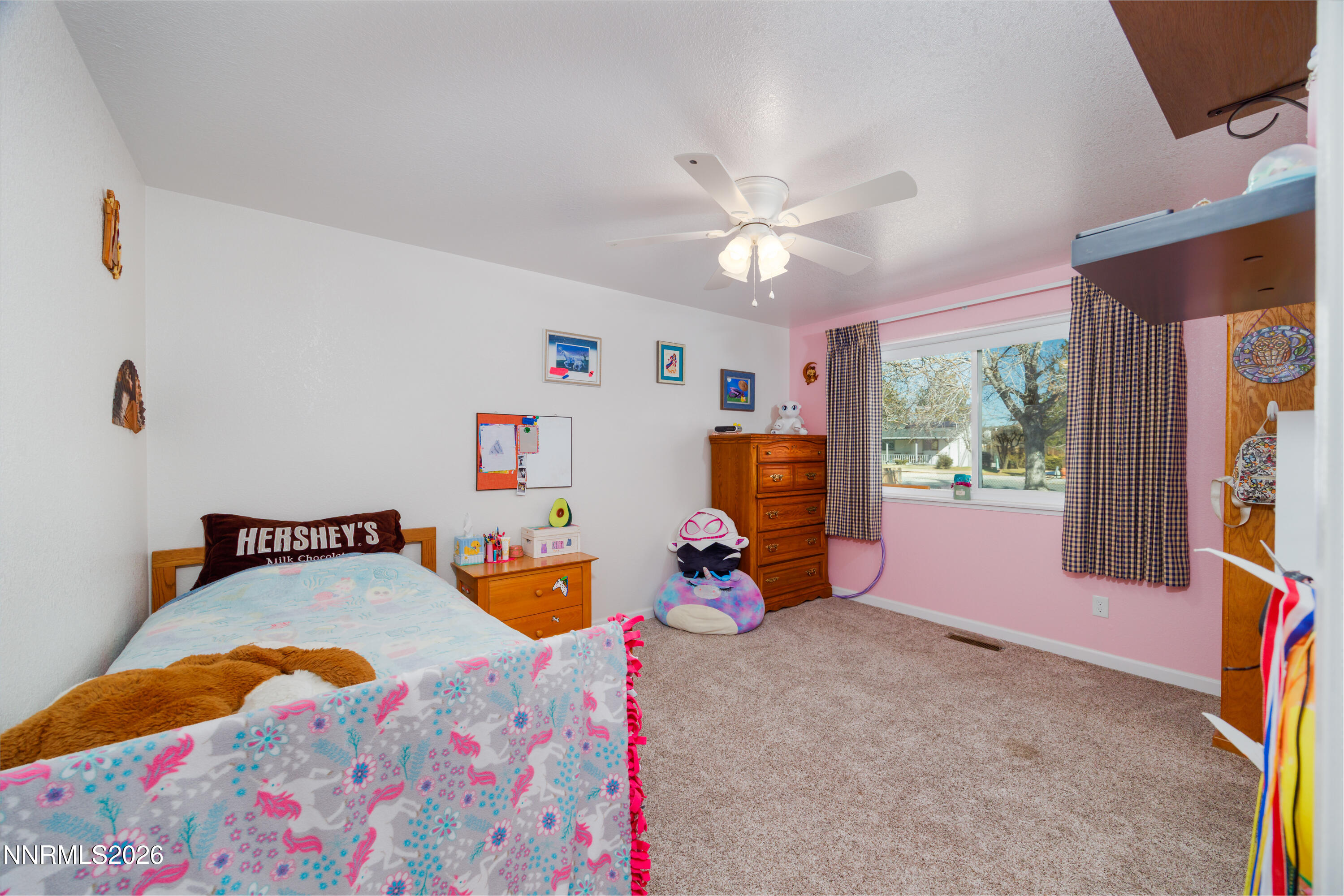 450 Riparian Way Carson City, NV 89701 - Photo 14 of 27 a bedroom with furniture and a flat screen tv