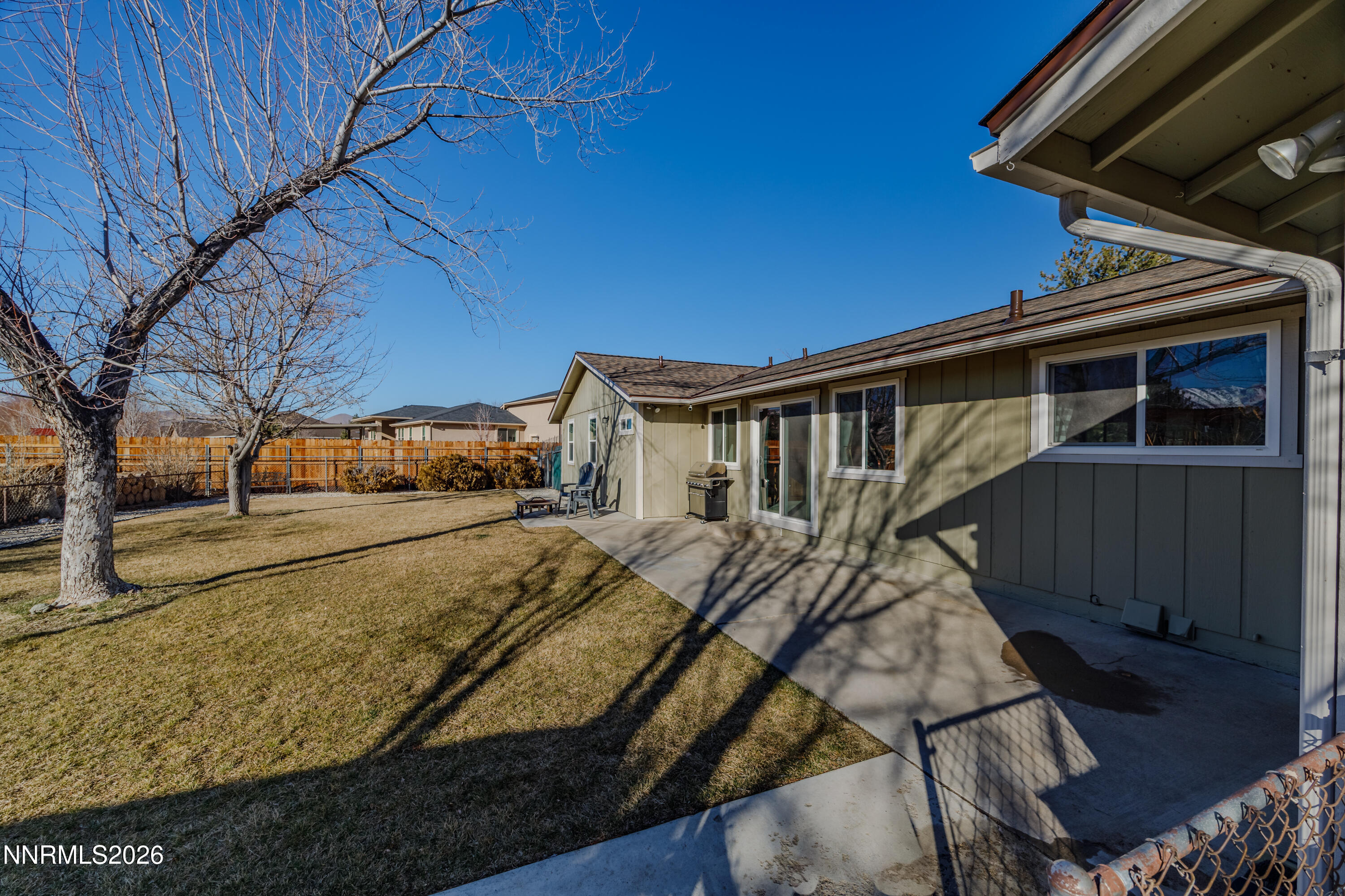 450 Riparian Way Carson City, NV 89701 - Photo 17 of 27 a view of a house with a yard