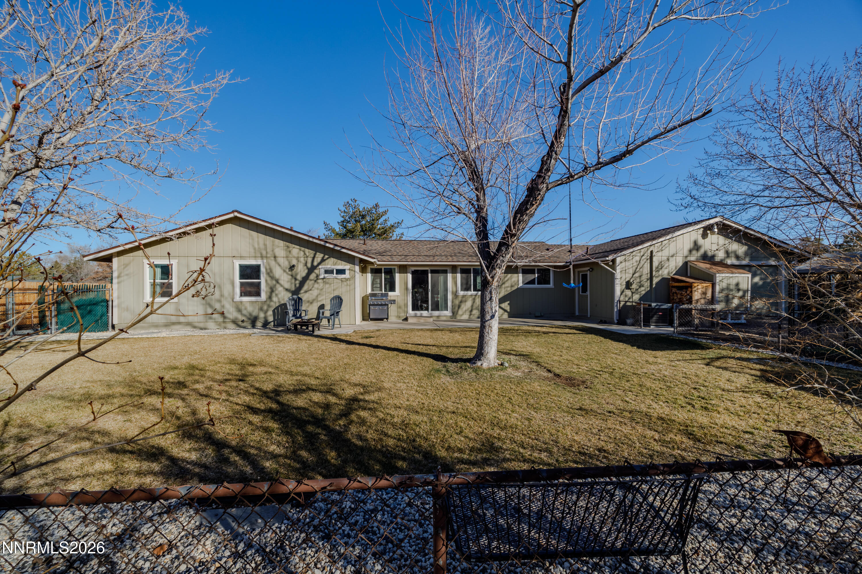 450 Riparian Way Carson City, NV 89701 - Photo 18 of 27 a view of a house with a yard