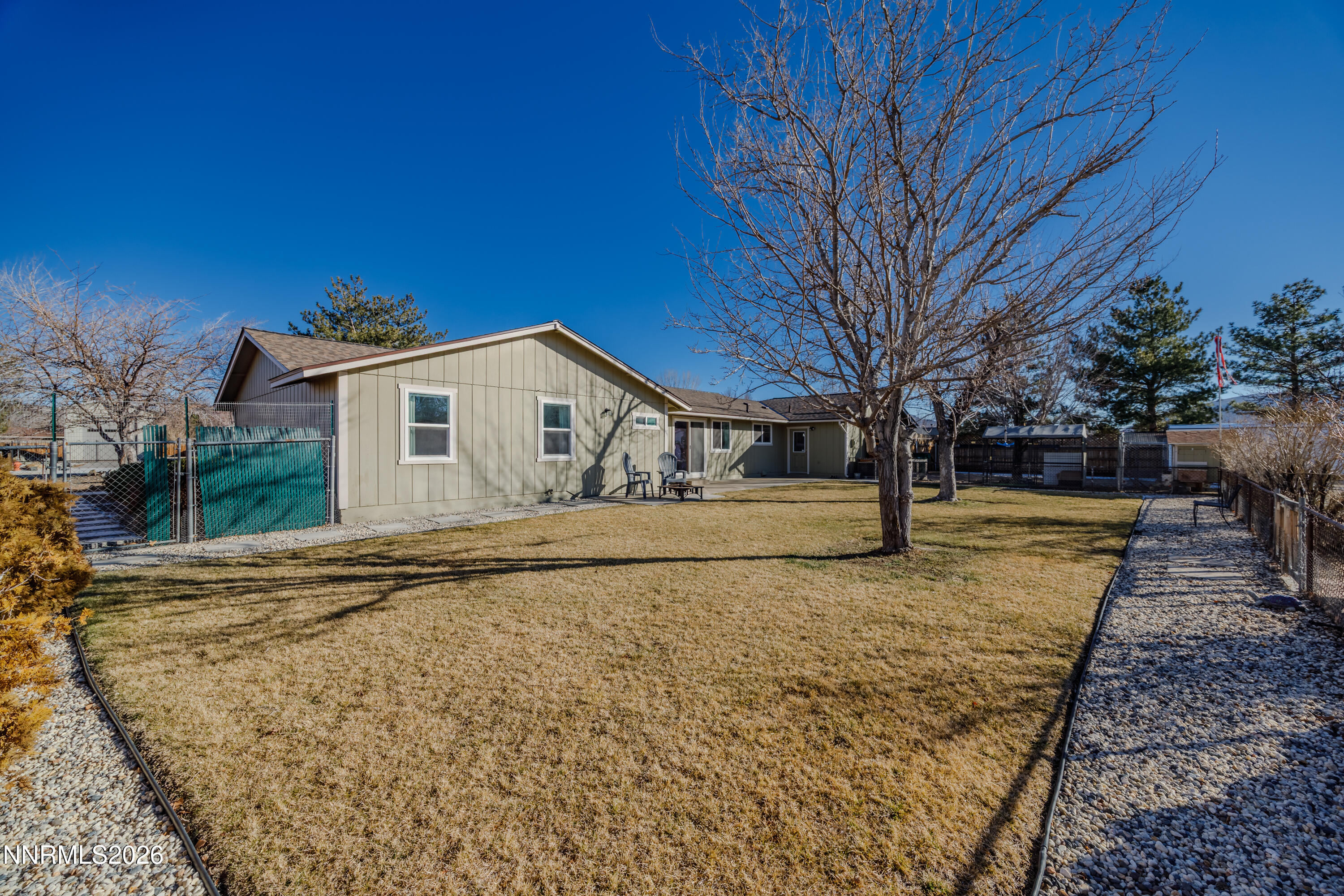 450 Riparian Way Carson City, NV 89701 - Photo 20 of 27 a view of white house with snow on the road