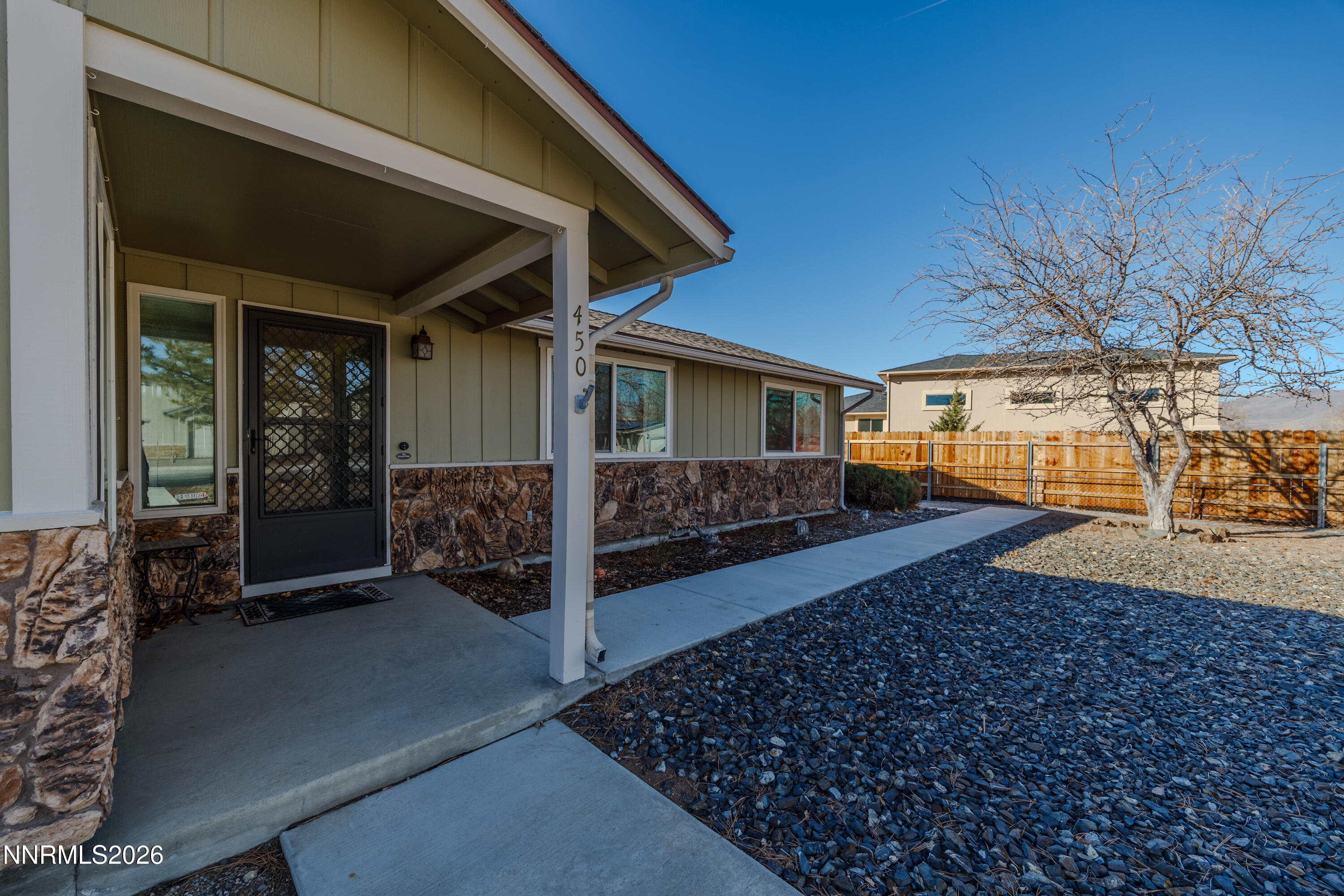 450 Riparian Way Carson City, NV 89701 - Photo 3 of 27 a view of a porch with furniture and a yard
