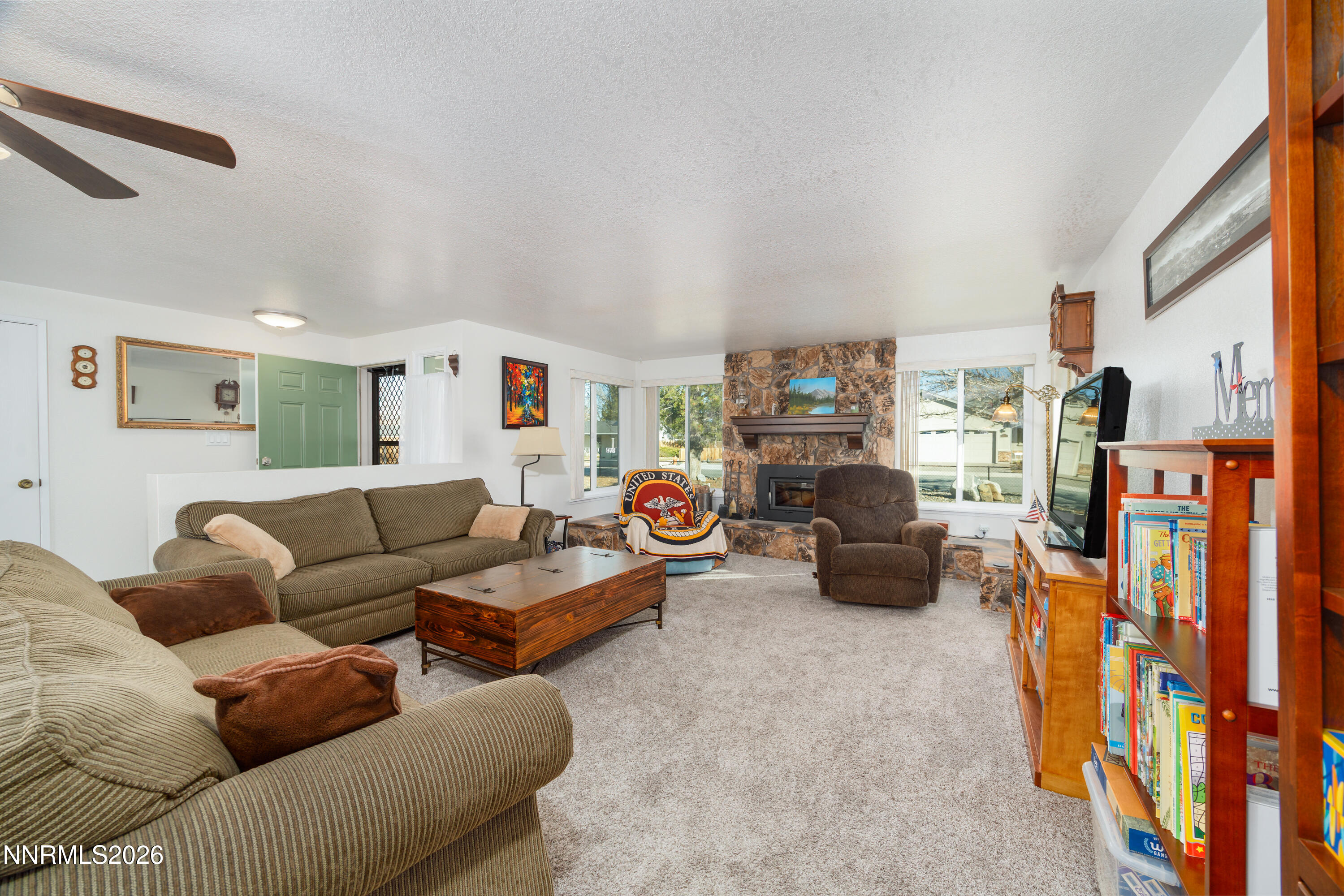 450 Riparian Way Carson City, NV 89701 - Photo 8 of 27 a living room with furniture and a flat screen tv