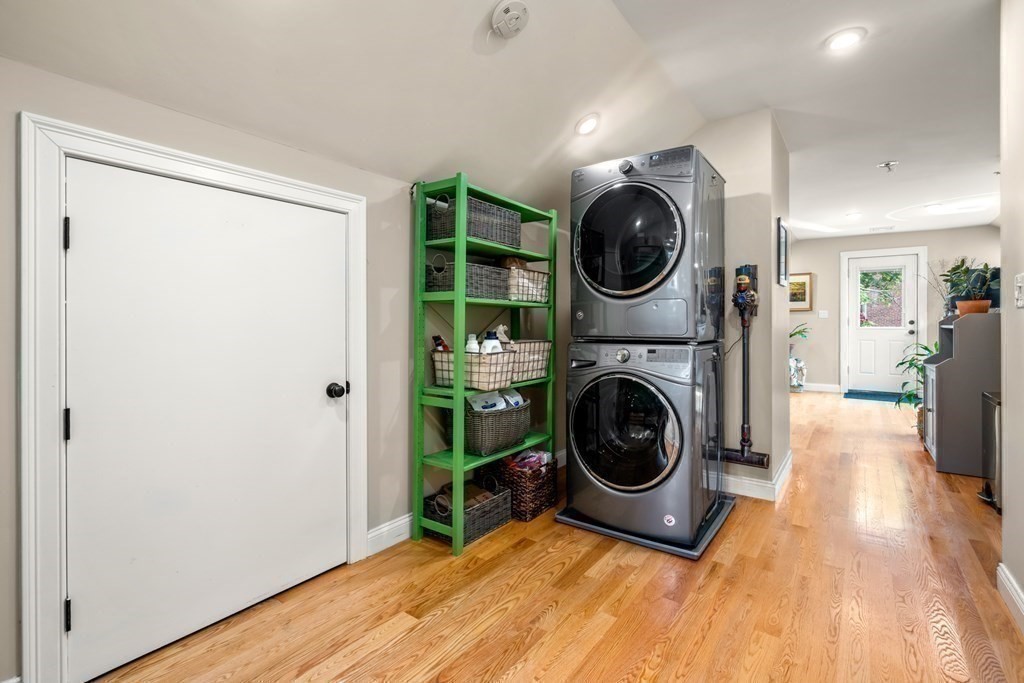 1-3 Howard Place, Unit B Boston, MA 02125 - Photo 13 of 25 a view of a hallway with washer and dryer