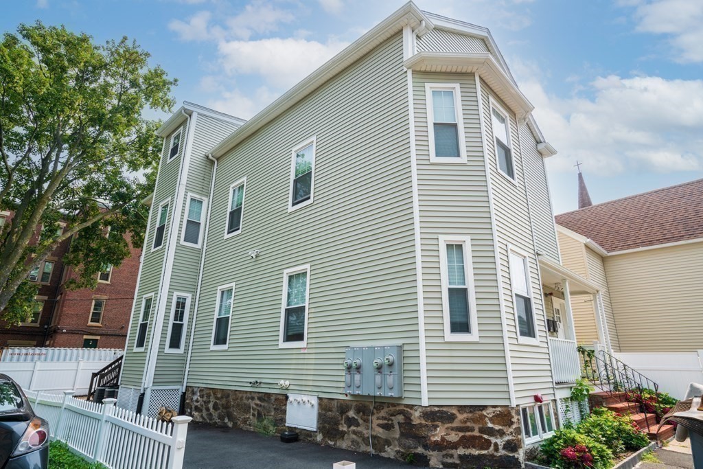 1-3 Howard Place, Unit B Boston, MA 02125 - Photo 23 of 25 a side view of a house