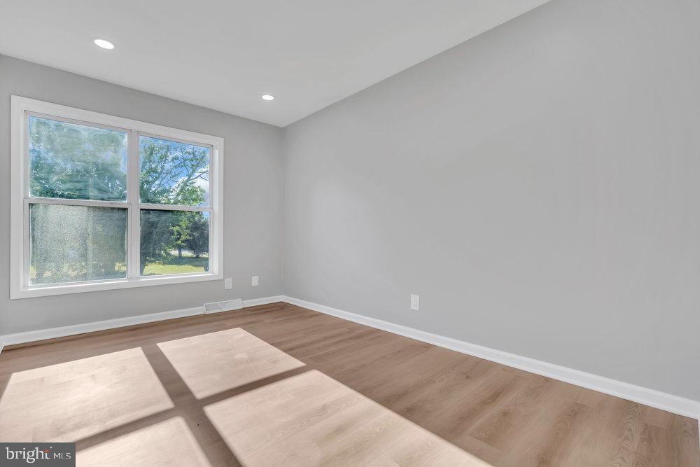 345 Spruce Street Bridgeton, NJ 08302 - Photo 11 of 43 an empty room with large windows