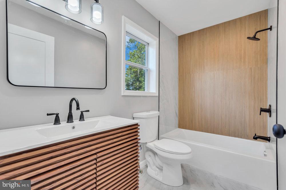 345 Spruce Street Bridgeton, NJ 08302 - Photo 14 of 43 a bathroom with a sink a toilet and shower