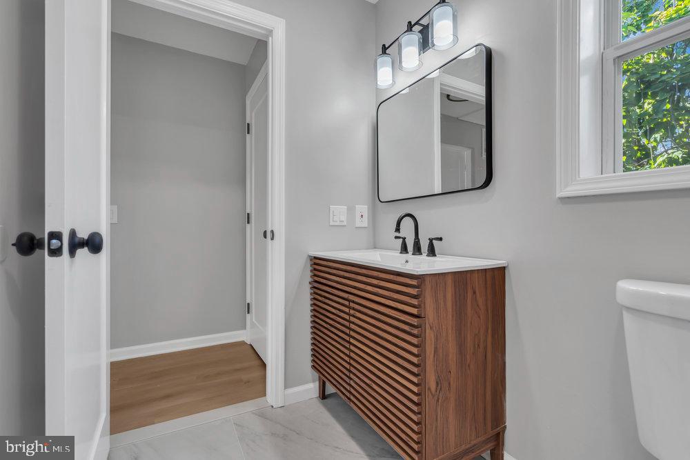 345 Spruce Street Bridgeton, NJ 08302 - Photo 16 of 43 a bathroom with sink and mirror