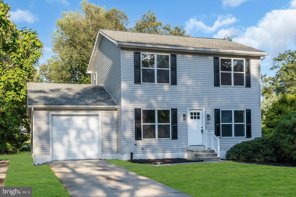345 Spruce Street Bridgeton, NJ 08302 - Photo 3 of 43 a front view of a house with a yard