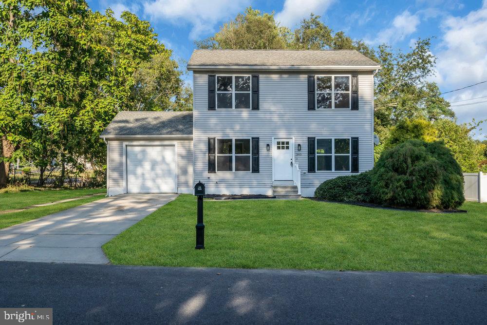 345 Spruce Street Bridgeton, NJ 08302 - Photo 6 of 43 a front view of a house with a yard