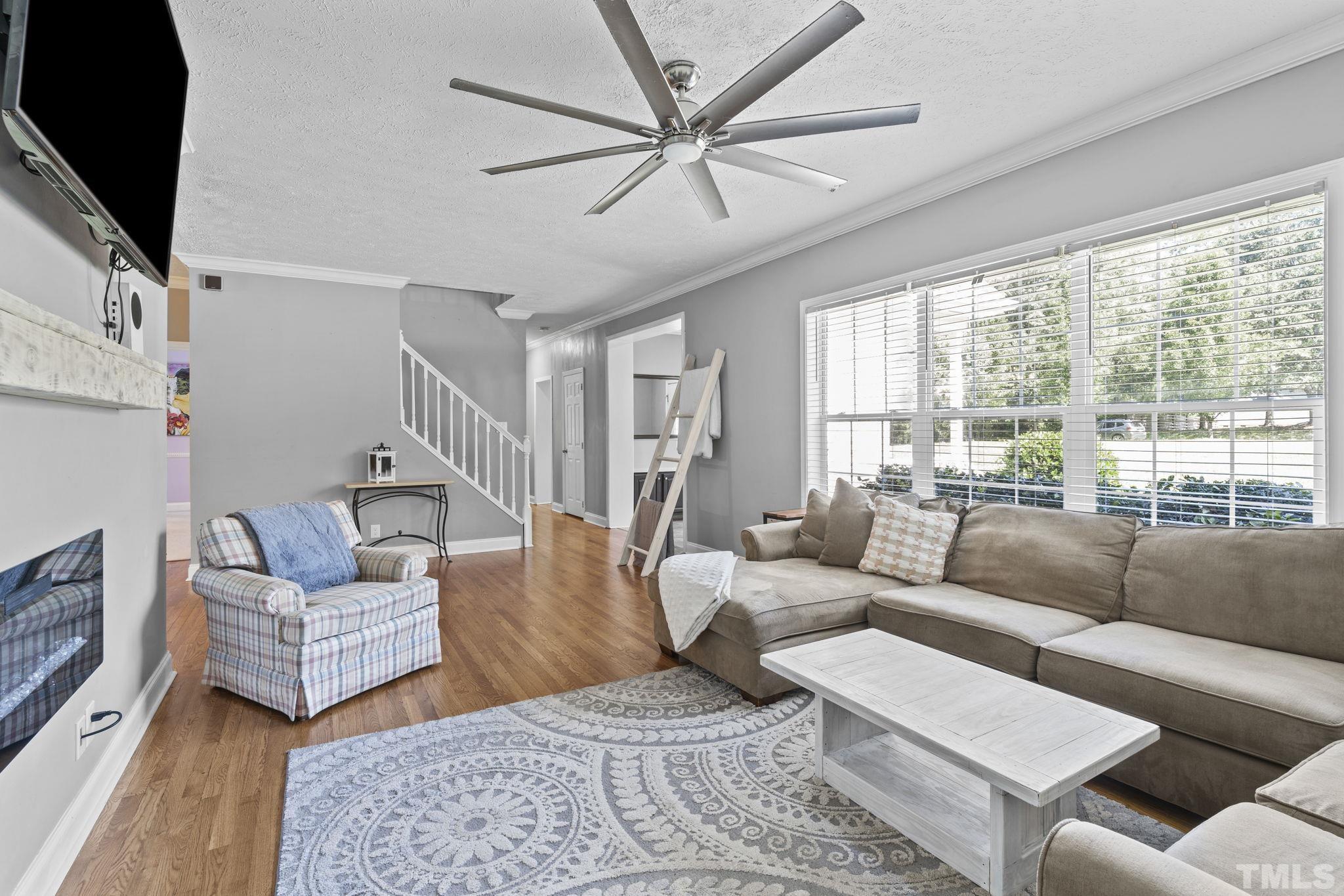 4236 Rockside Hills Drive Raleigh, NC 27603 - Photo 6 of 28 a living room with furniture and a large window