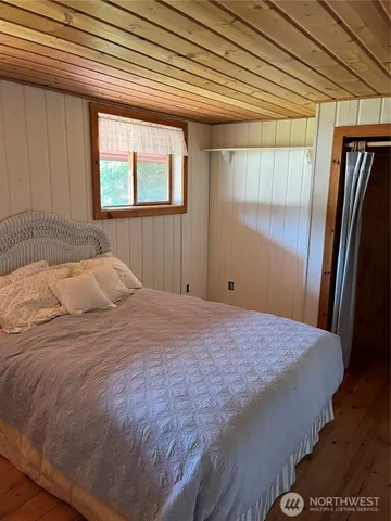 a bathroom with a sink a mirror and a window