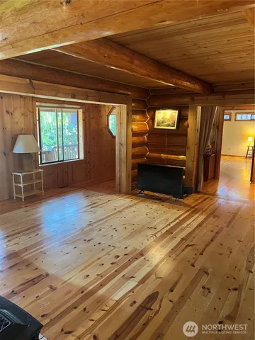 a view of a livingroom with furniture and window