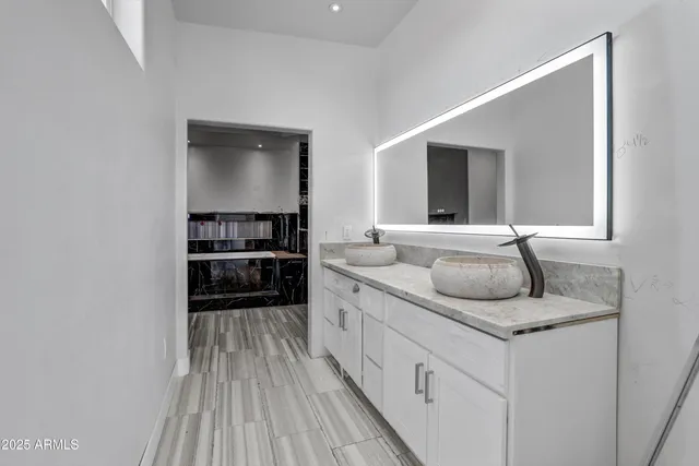 a kitchen with stainless steel appliances granite countertop a sink and cabinets