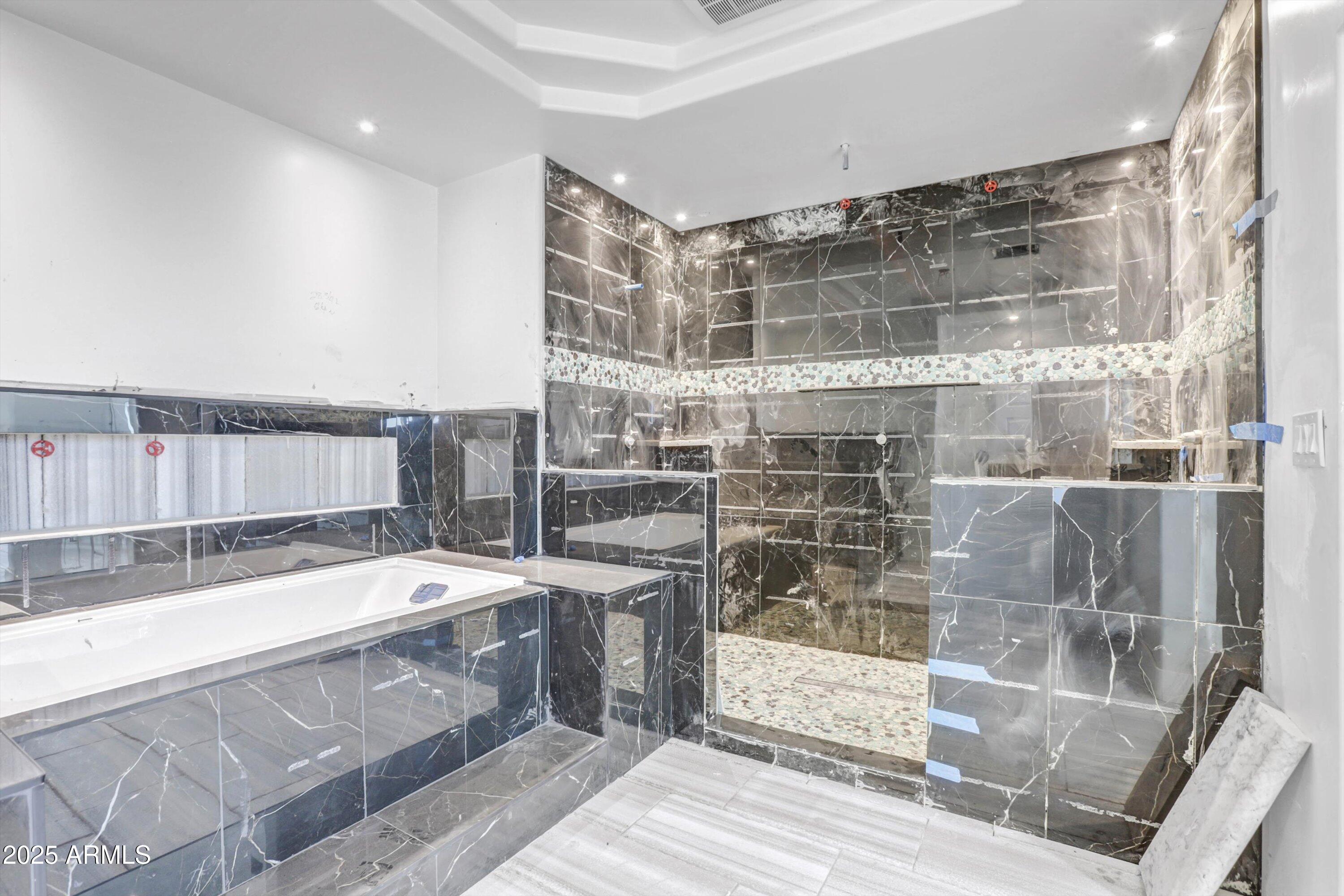 317 West Frontier Street Apache Junction, AZ 85120 - Photo 13 of 28 a spacious bathroom with a tub and shower