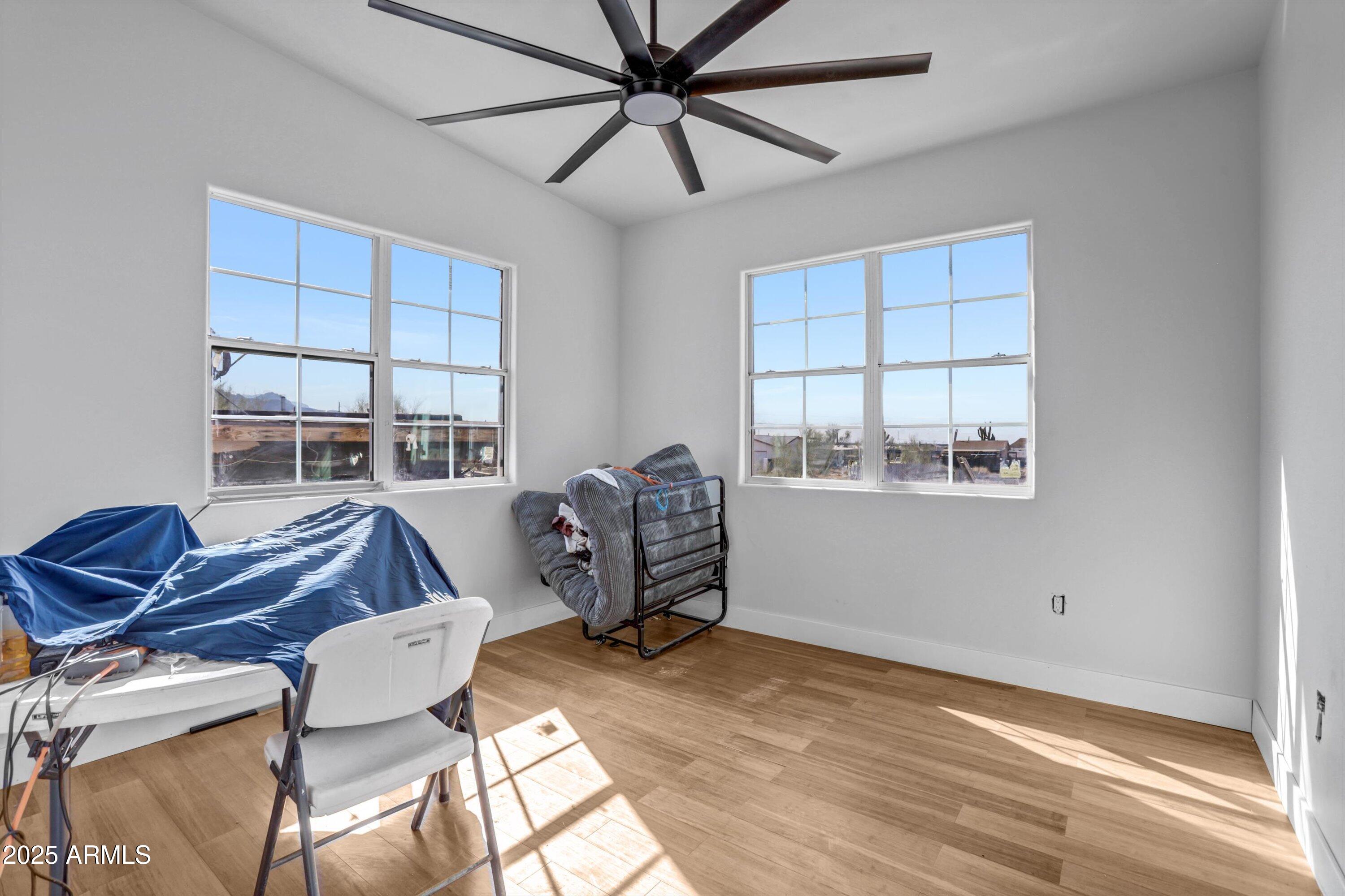 317 West Frontier Street Apache Junction, AZ 85120 - Photo 14 of 28 a living room with furniture a window and a ceiling fan