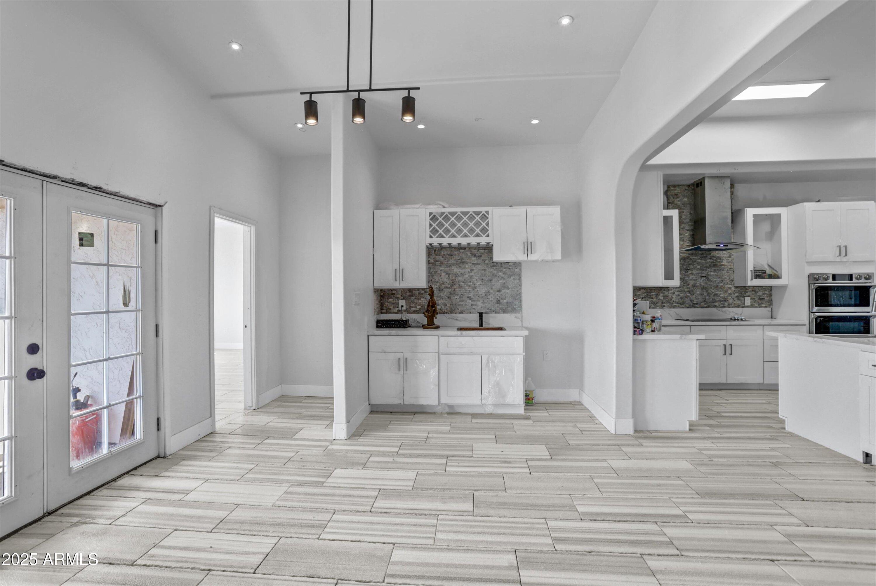 317 West Frontier Street Apache Junction, AZ 85120 - Photo 25 of 28 a large white kitchen with cabinets