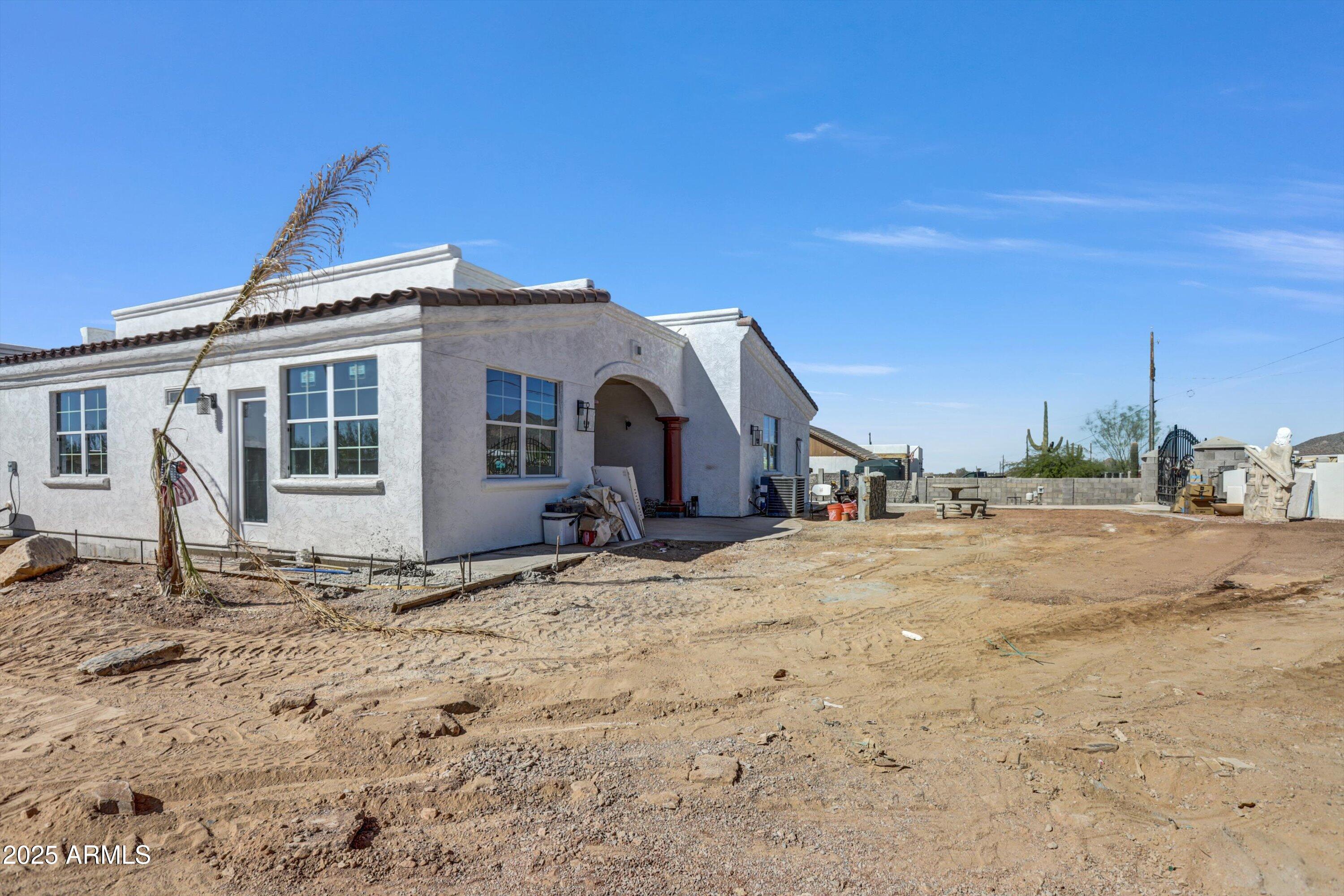 317 West Frontier Street Apache Junction, AZ 85120 - Photo 4 of 28 a front view of a house with a yard