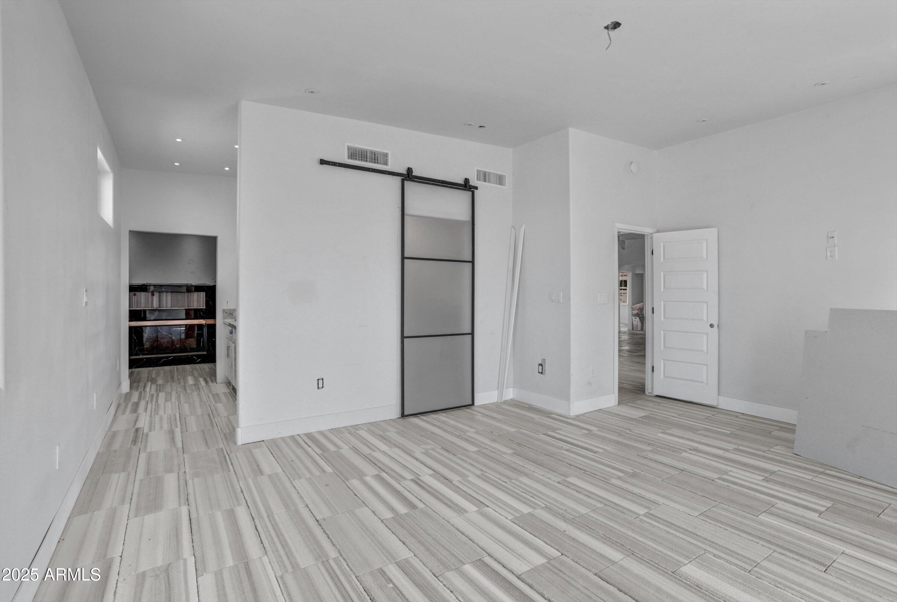 317 West Frontier Street Apache Junction, AZ 85120 - Photo 10 of 28 a view of empty room with wooden floor