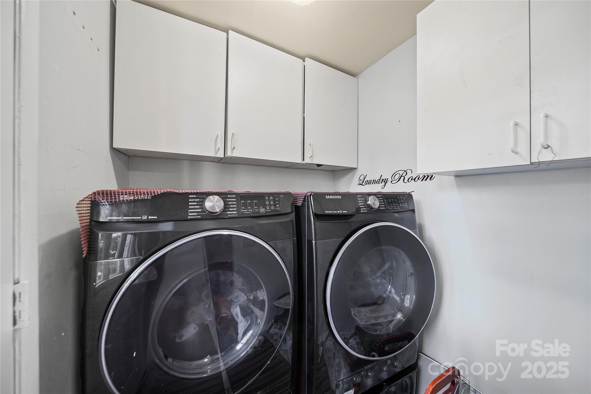 4823 Smokehollow Road Charlotte, NC 28227 - Photo 11 of 31 a utility room with dryer and washer