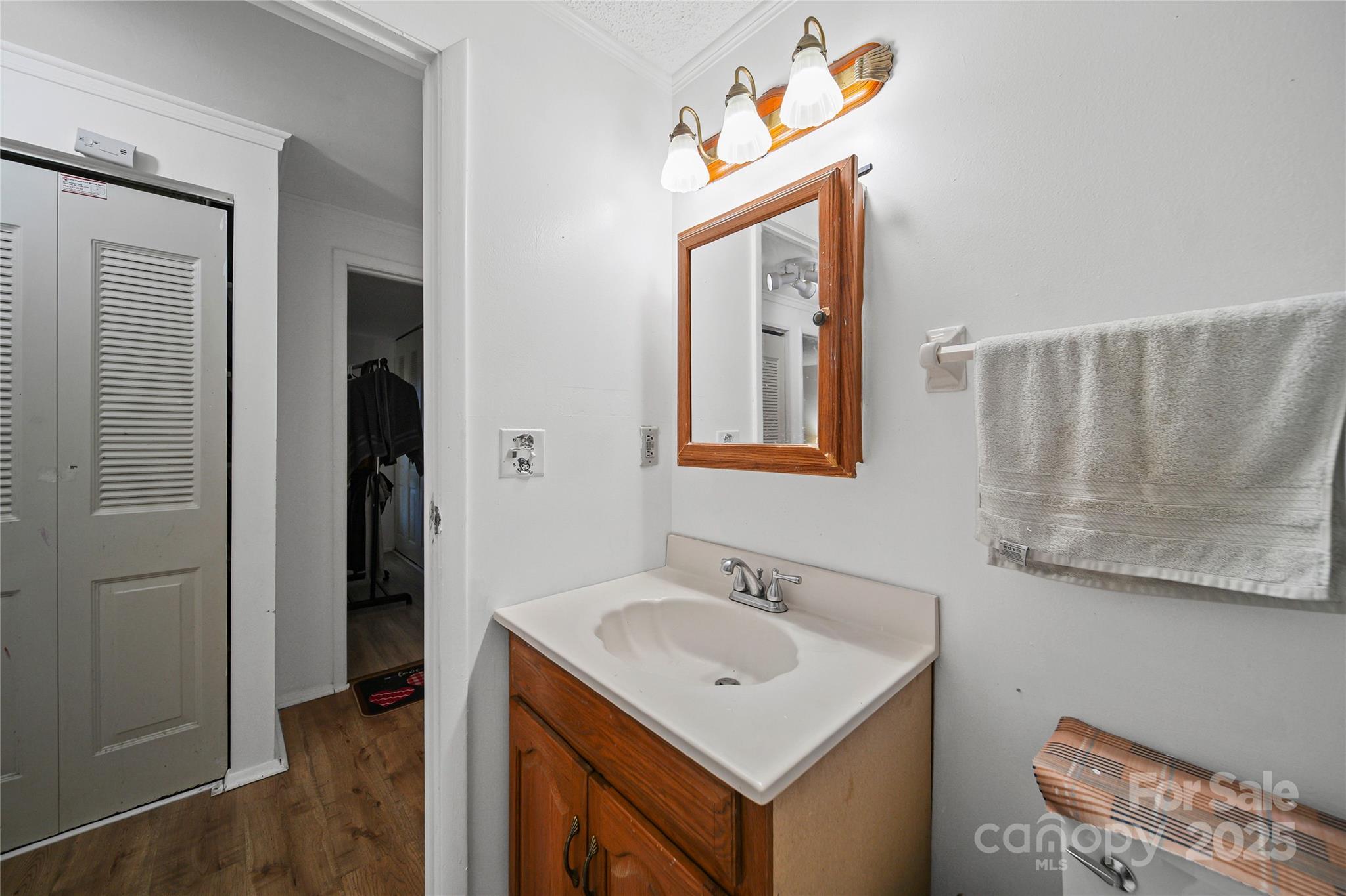 4823 Smokehollow Road Charlotte, NC 28227 - Photo 13 of 31 a bathroom with a sink a mirror and a shower