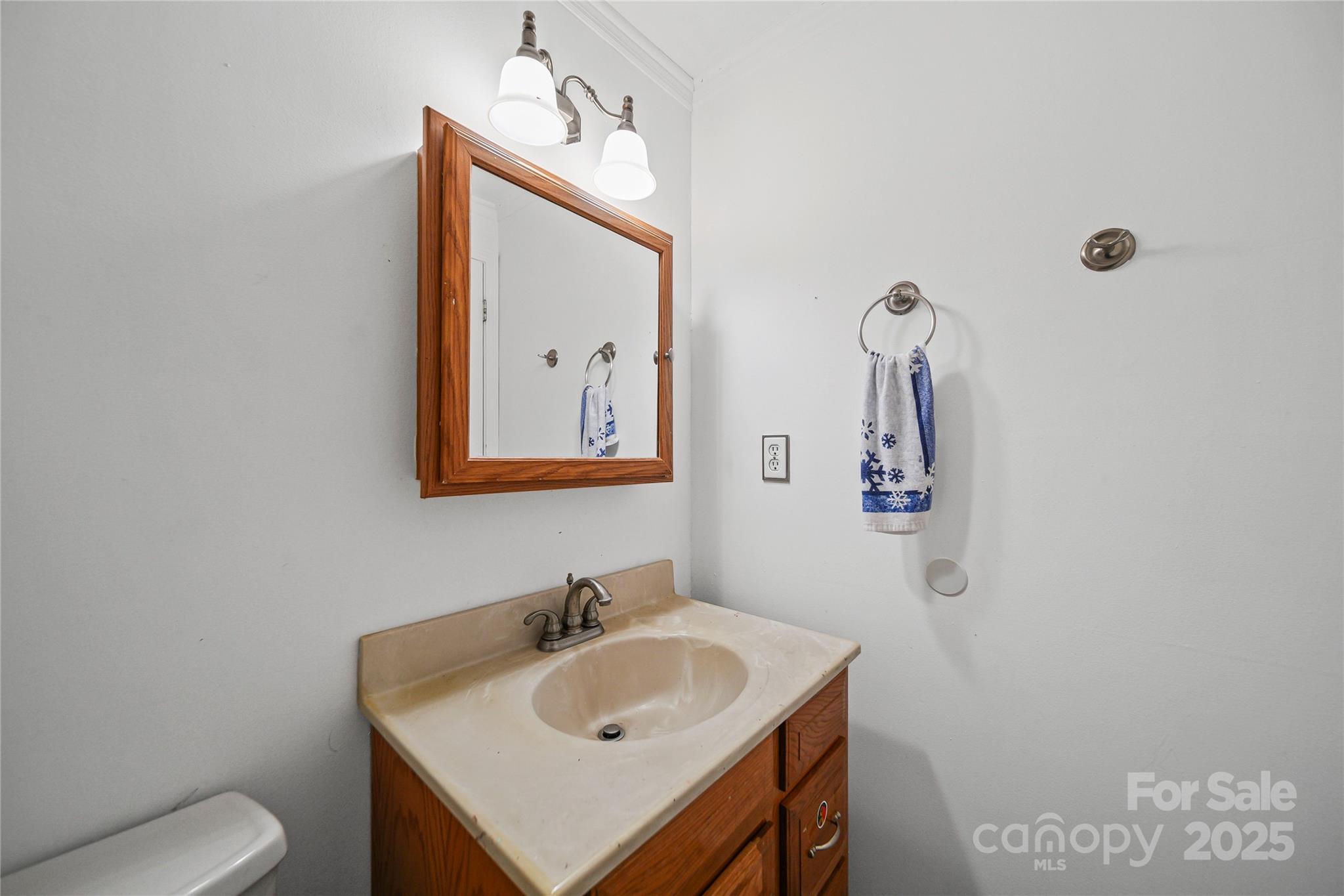 4823 Smokehollow Road Charlotte, NC 28227 - Photo 17 of 31 a bathroom with a toilet sink and mirror