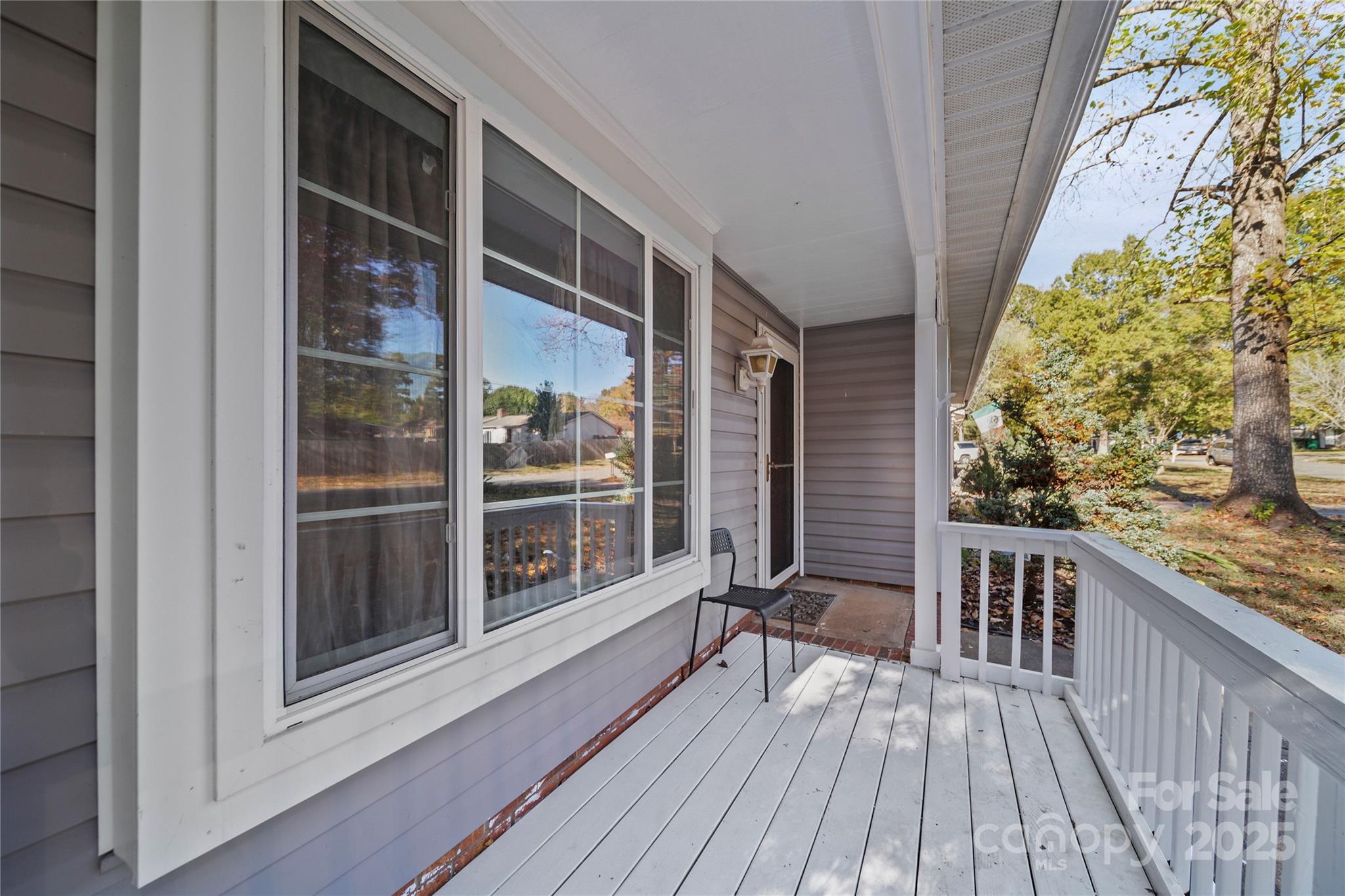 4823 Smokehollow Road Charlotte, NC 28227 - Photo 2 of 31 a balcony with wooden floor
