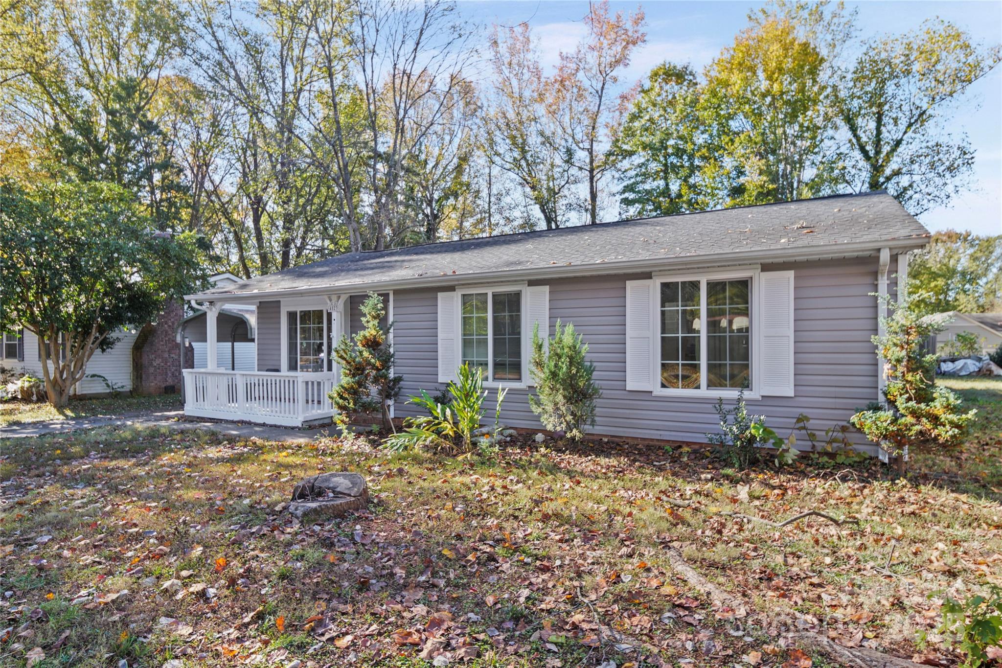 4823 Smokehollow Road Charlotte, NC 28227 - Photo 22 of 31 a front view of a house with garden