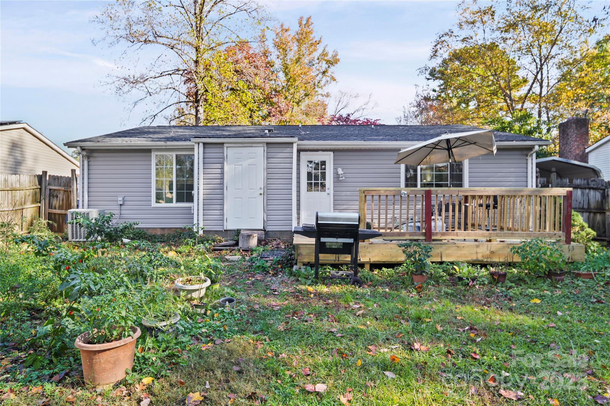 4823 Smokehollow Road Charlotte, NC 28227 - Photo 26 of 31 a front view of a house with garden