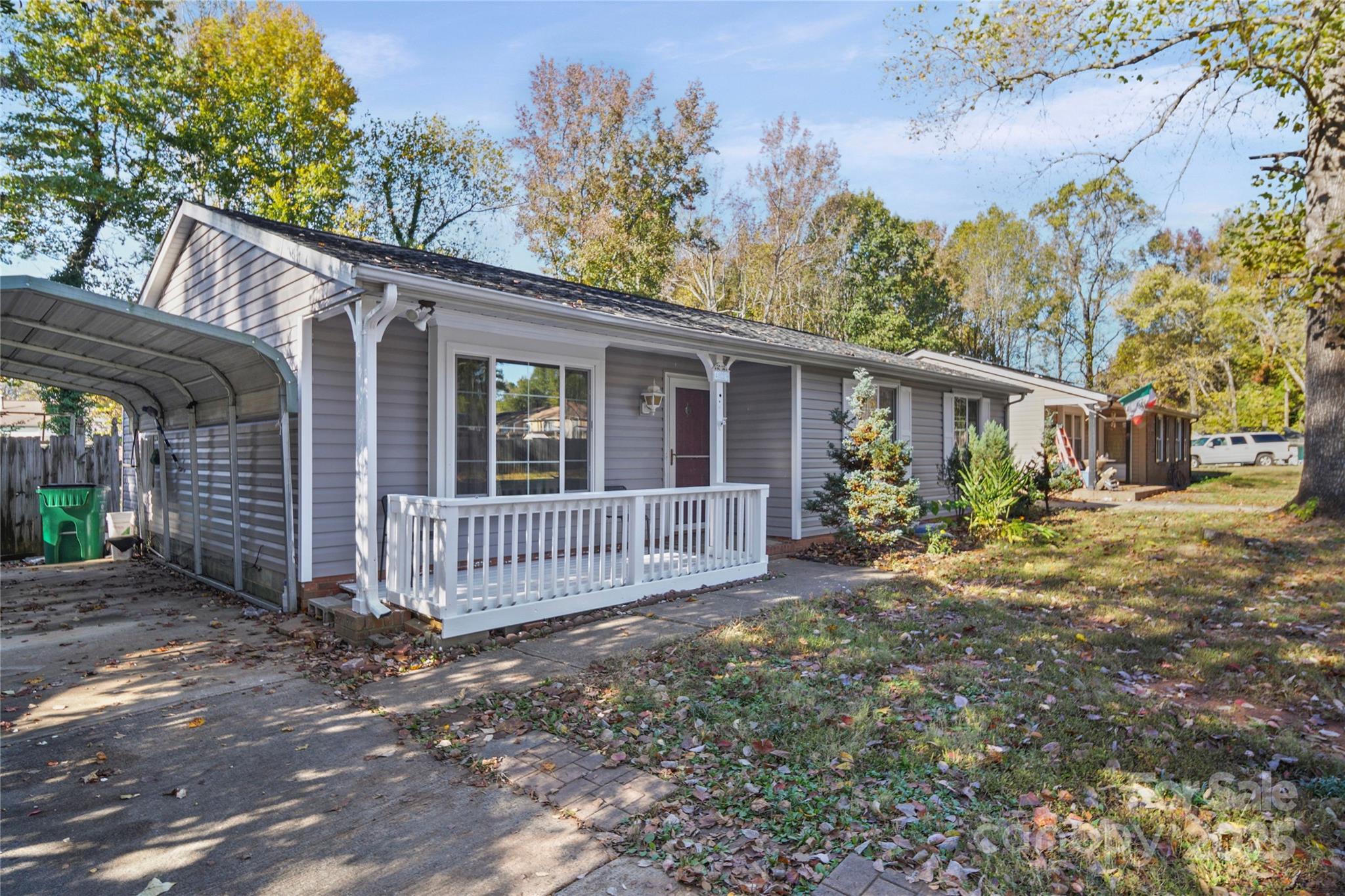 4823 Smokehollow Road Charlotte, NC 28227 - Photo 29 of 31 a view of a house with a yard and wooden fence