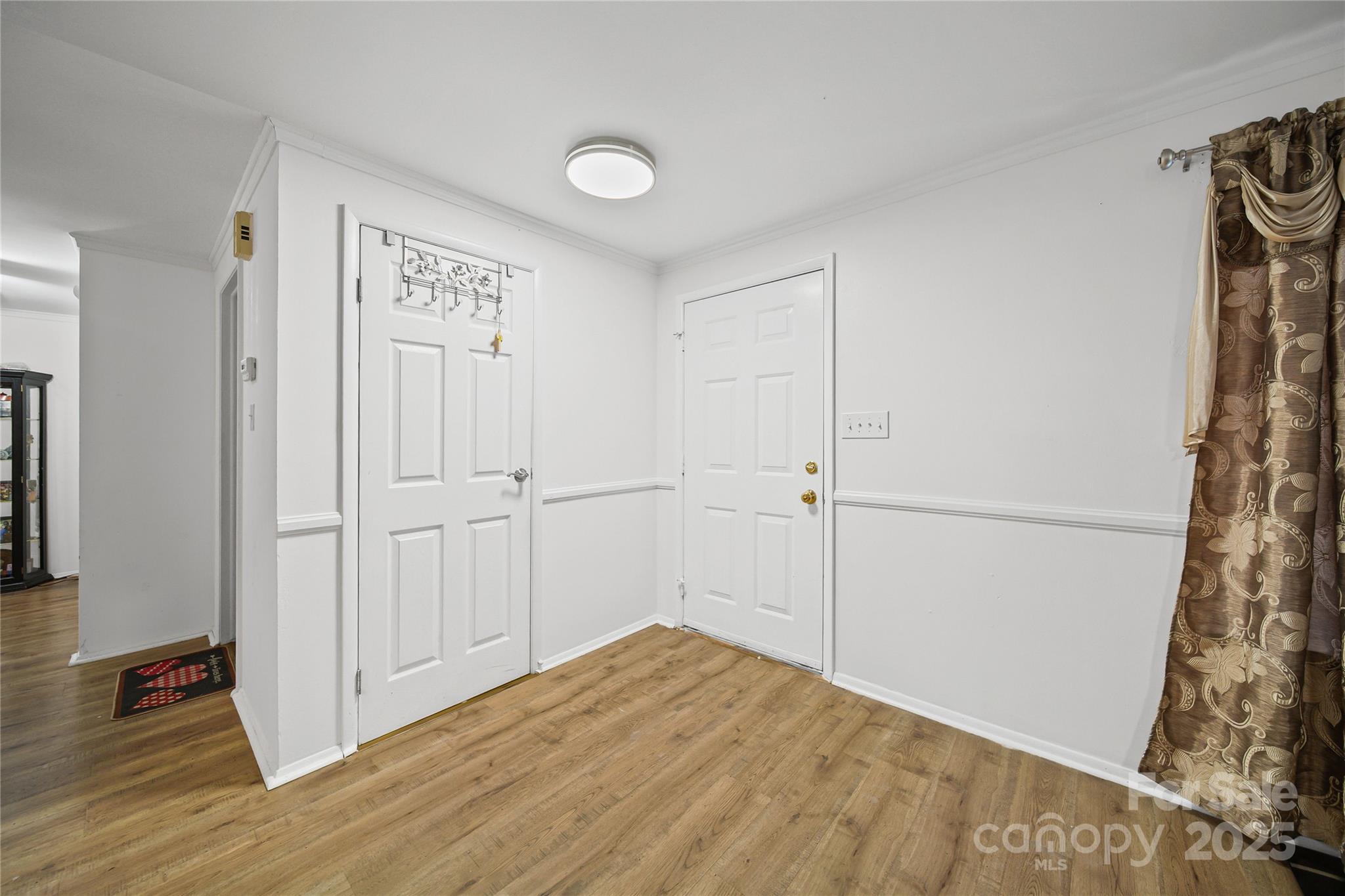 4823 Smokehollow Road Charlotte, NC 28227 - Photo 3 of 31 a view of a livingroom with wooden floor